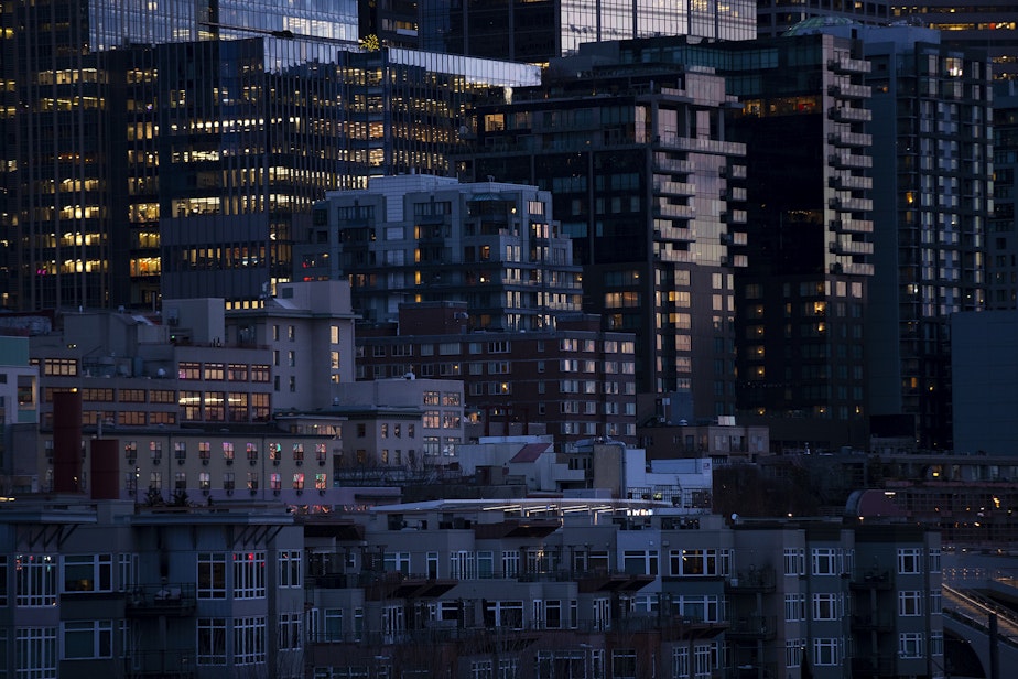 caption: The setting sun is reflected on buildings in downtown Seattle shortly after 5 p.m., on Tuesday, February 4, 2025, in Seattle.