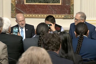 caption:  Federal, state and tribal leaders officially signed an agreement Friday to better protect salmon in the Columbia River and halt court cases for the next 10 years.