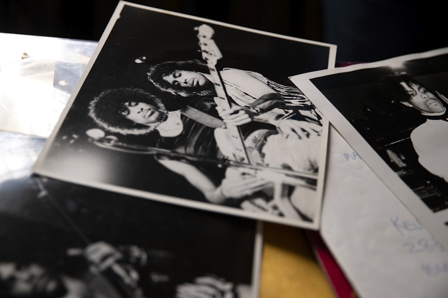 caption: Retiring KEXP DJ Kevin Cole looks through a box of Prince memorabilia at his home studio on Monday, July 8, 2024, in Seattle.