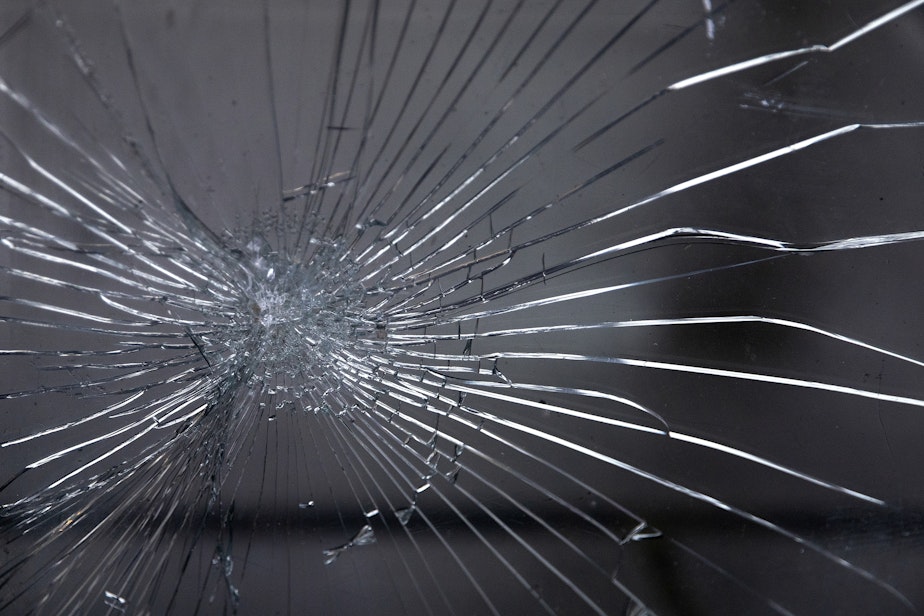 caption: Shattered glass is shown at the entrance of XPress Tax Services along S. Jackson Street on Thursday, March 20, 2025, in Seattle’s Little Saigon neighborhood.