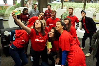 caption: Crosscut newsroom employees at their office in downtown Seattle. The newsroom recently announced a unionizing effort.