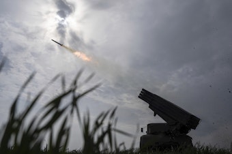 caption: A Ukrainian MSLR BM-21 "Grad" fires toward Russian positions in the Donetsk region of eastern Ukraine, April 8.