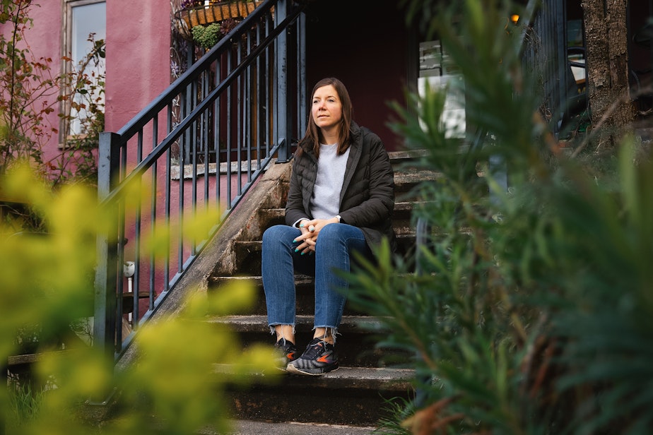 caption: Desirae Aylesworth is portrayed on Monday, March 31, 2025, outside of Wild Mountain Cafe in Seattle.