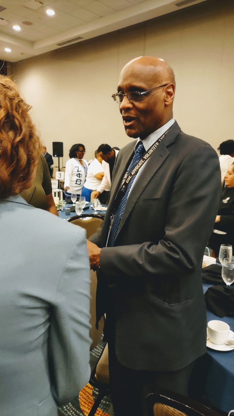 caption: Stanley Earley III talks with attendees at a luncheon for descendants and friends of the 6888, the battalion Earley's mother, Lt. Col. Charity Adams Earley led during WWII>