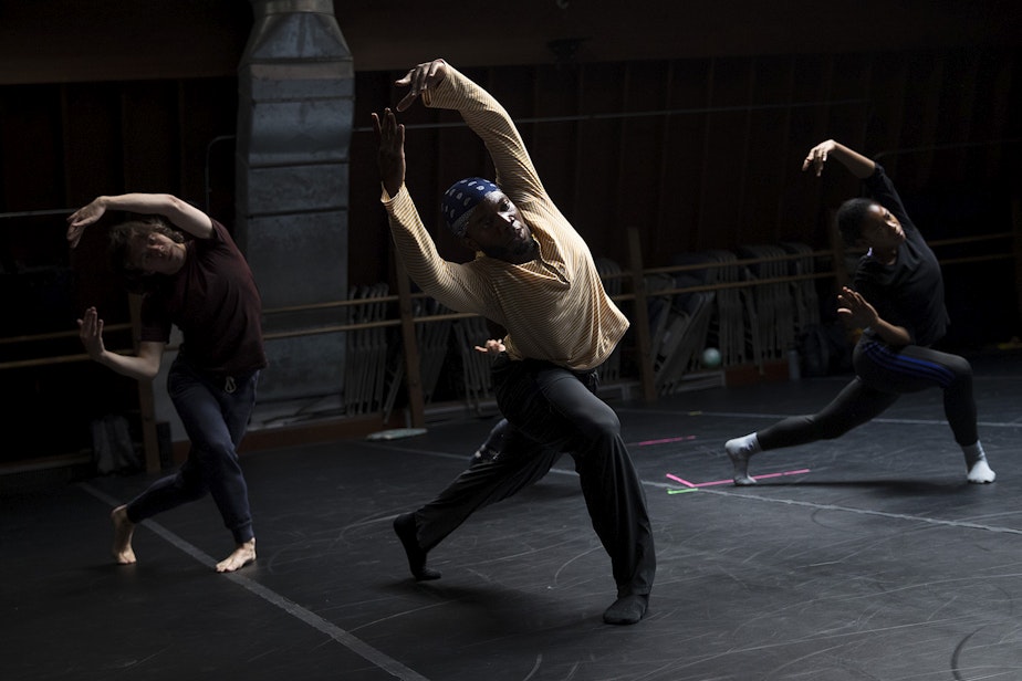 caption: Dancers including Mikhail Calliste, center, rehearse on Monday, September 17, 2018, at Spectrum Dance Theater in Seattle.