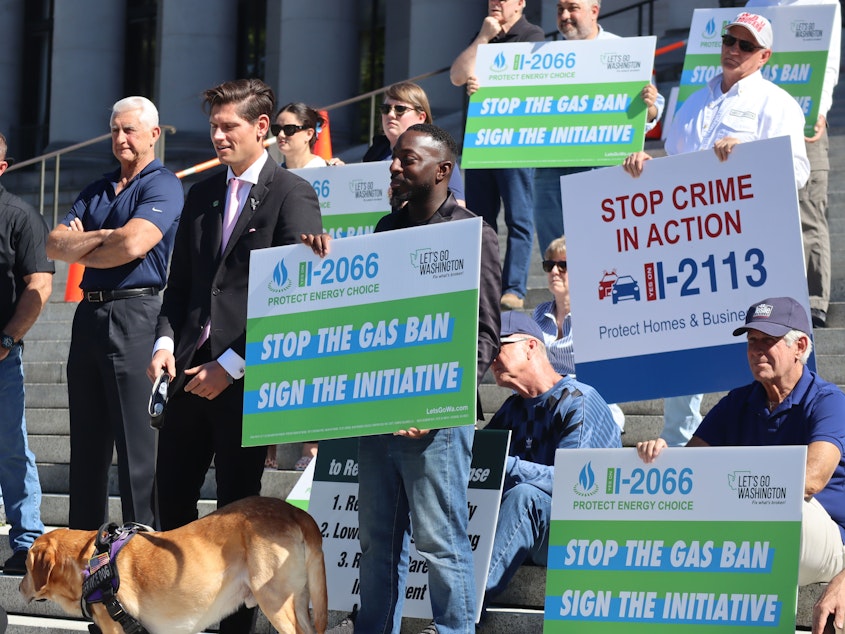 caption: Initiative supporters stand on the steps of the Washington capitol in Olympia June 6, 2024, to celebrate progress of the measures backed by the group Let's Go Washington, which also helped gather signatures to put I-2066 on the ballot in November.