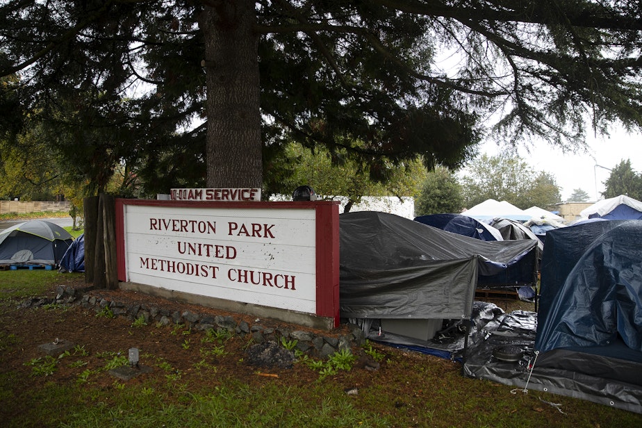 caption: Tents are shown outside of Riverton Park United Methodist Church where nearly 200 people are sheltering while seeking asylum, on Monday, Oct. 16, 2023, in Tukwila.
