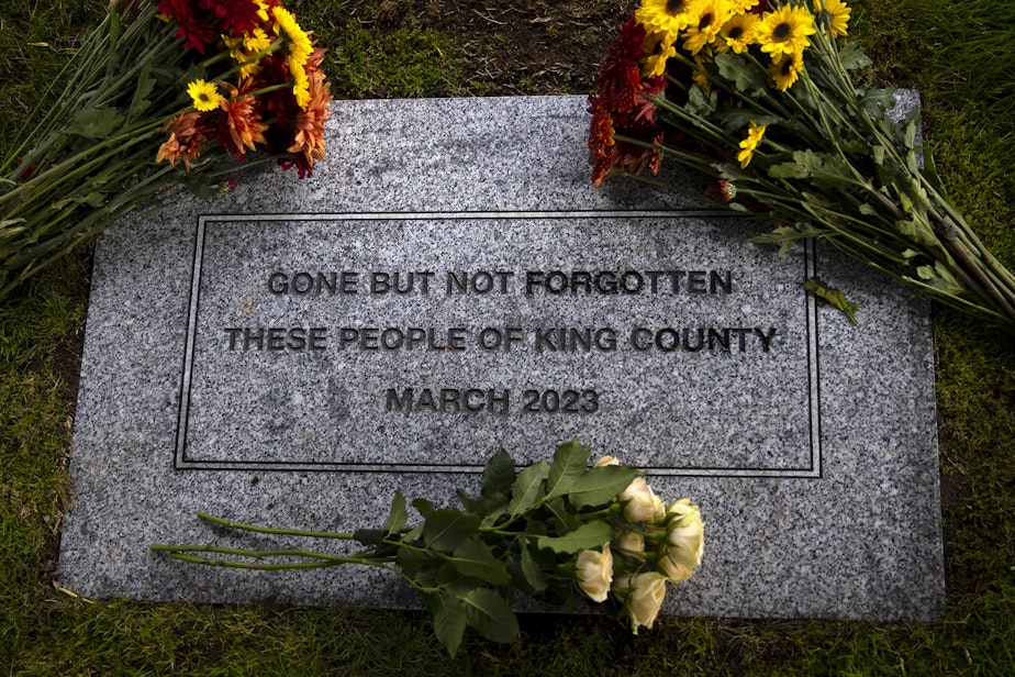 caption: The King County Medical Examiner’s Office hosted the 2023 Indigent Remains ceremony on Wednesday, October 25, 2023, at Mt. Olivet Cemetery in Kent. Faith leaders read aloud the names of 302 people who died in King County last year who either could not pay for a burial service or whose family could not be located by the county.