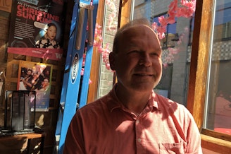 caption: Chris Peterson, co-owner of Cafe Allegro, Seattle's original coffeehouse. 