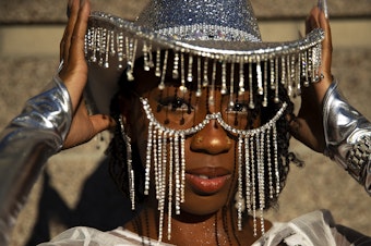caption: Kieyira Flintroy of Las Vegas poses for a portrait while waiting in line to see Beyonce’s Seattle stop on the Renaissance World Tour on Thursday, Sept. 14, 2023, at Lumen Field in Seattle.