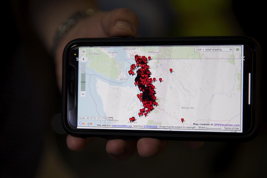 caption: Aaron Syring, owner and pharmacist at Island Drug, displays a map showing the addresses of all of the individuals vaccinated against Covid-19 at the store in one single day, on Wednesday, April 7, 2021, at Island Drug in Oak Harbor.
