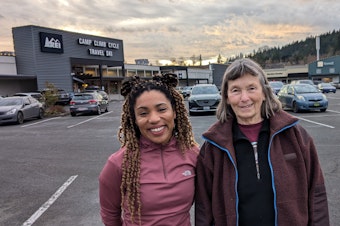 caption: REI Bellingham employees Tini Alexander (left) and Sue Cottrell helped unionize their store in 2023.