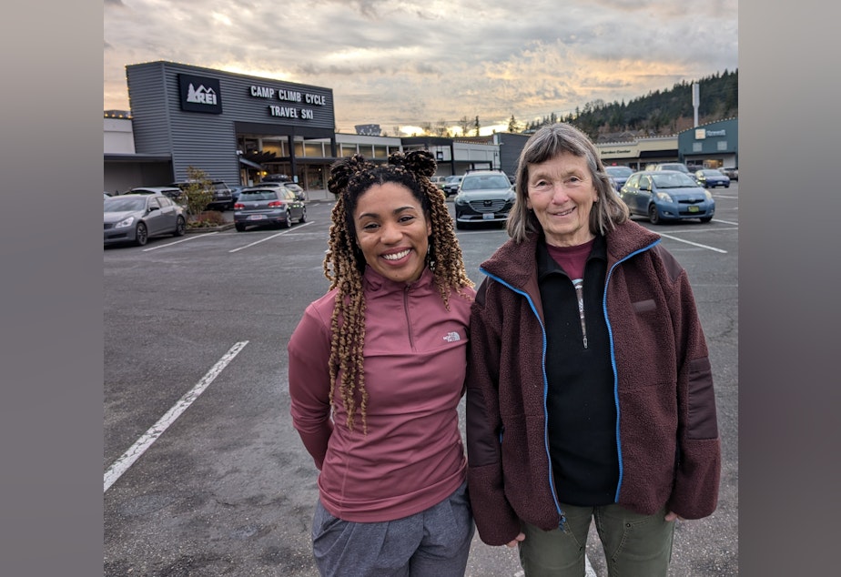 caption: REI Bellingham employees Tini Alexander (left) and Sue Cottrell helped unionize their store in 2023.