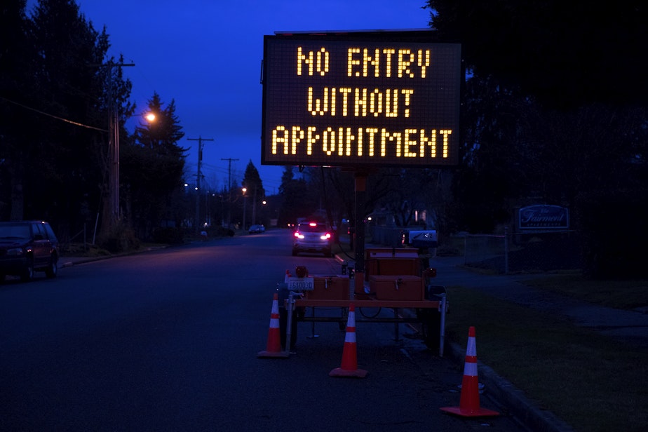 caption: A sign reads 'No Entry Without Appointment' on Thursday, January 28, 2021, at a drive-thru Covid-19 vaccination clinic at the Washington State Fair Events Center in Puyallup. The clinic vaccinated approximately 2,000 people in phases 1A and 1B of the state’s vaccination plan on Thursday.