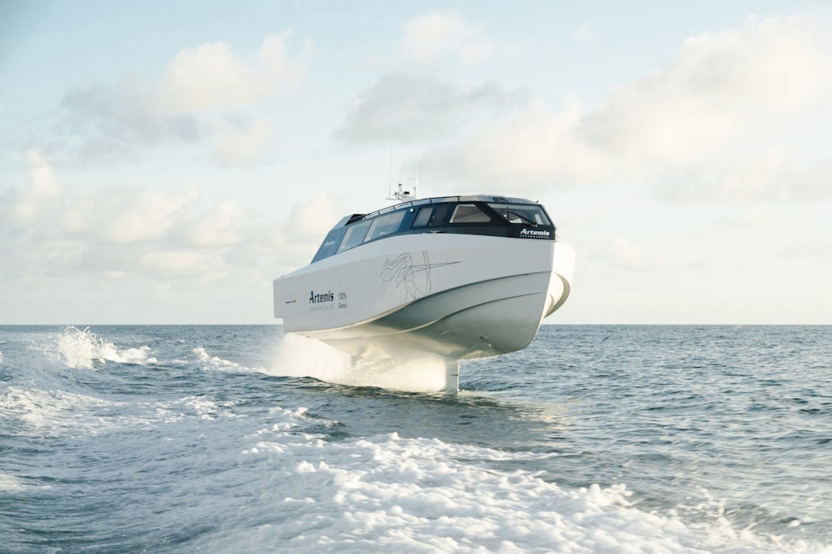 caption: The smaller Artemis EF-12 model rides above the waves near Miami
