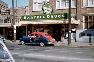 caption: Bartell Drugs on Greenwood Avenue in Seattle, just north of 85th Street, circa 1950s. 