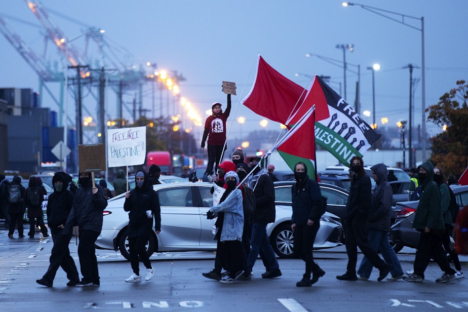 caption: Hundreds gathered to protest the MV Cape Orlando, a U.S. military vessel bound for Israel, on Monday, November 6, 2023, at the Port of Tacoma.