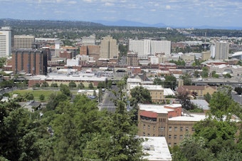 caption: In this photo taken June 4, 2018, the downtown skyline is shown from the South Hill in Spokane, Wash. 