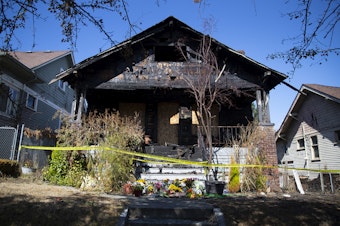 caption: A home near the intersection of North 48th Street and Whitman Avenue North, where two children and two adults were found deceased over the weekend, is shown on Tuesday, September 5, 2023, in the Wallingford neighborhood of Seattle. 