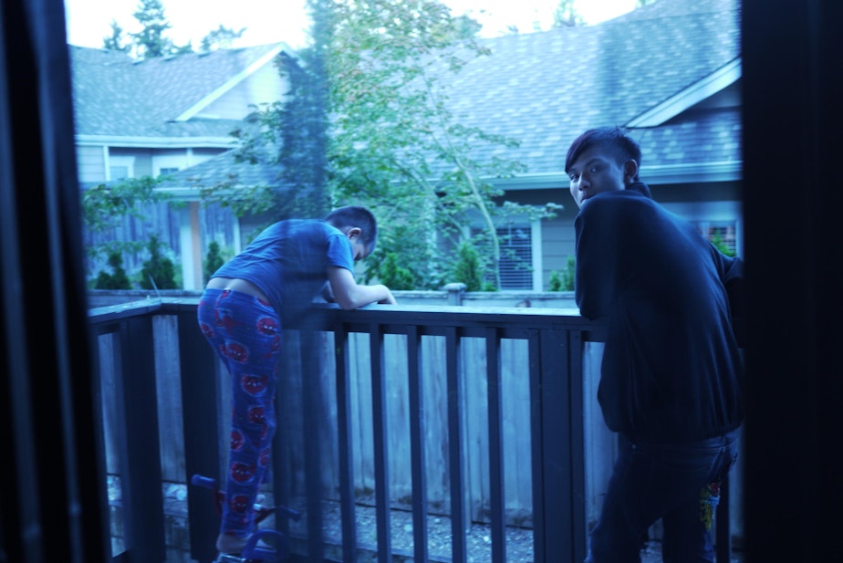 caption: Tu Tu checks out his new apartment in Kent and meets his younger relatives who were born in America.
