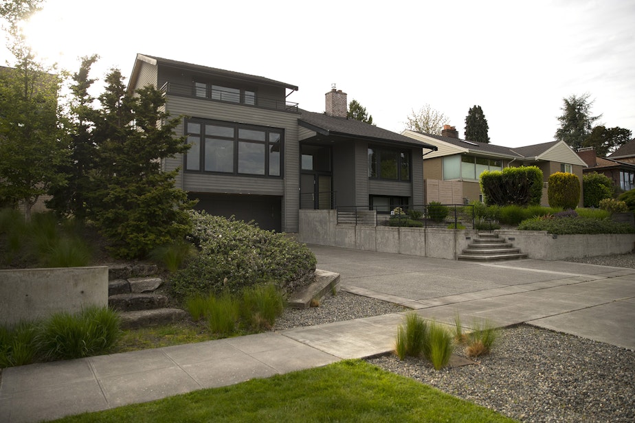 caption: Dr. John and Mary Henry lived in this house, which is a Seattle historical site, on Lakeshore Drive South in Seward Park. Benjamin McAdoo, a renowned architect, designed the house using a Modernist style. The Henrys moved in in 1960.