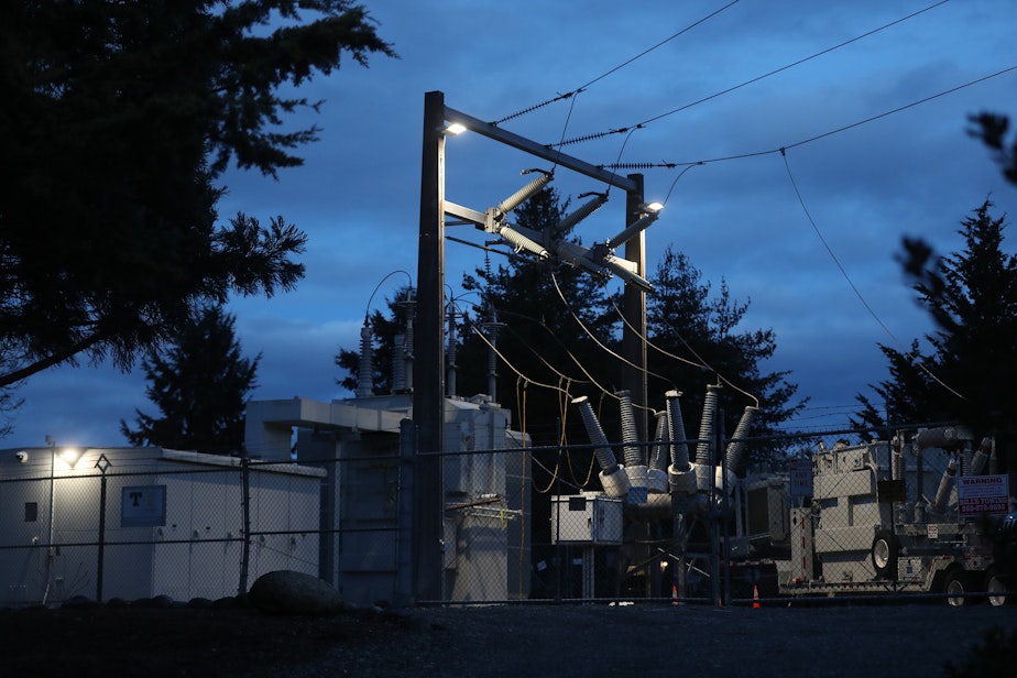 caption: A mobile substation rig sits behind a Tacoma Public Utilities substation, sabotaged on Christmas Day, on Jan. 16, in Spanaway, Washington.