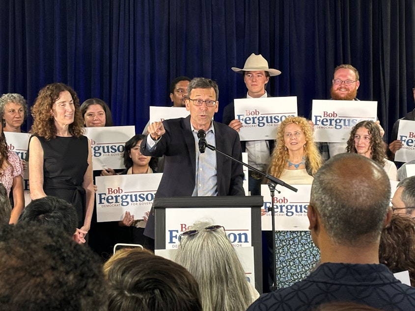 caption: Bob Ferguson, the Democrat gubernatorial candidate for Washington state, speaks to supporters at a Ballard bar in Seattle on Tuesday, Aug. 6, 2024.