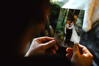 caption: Alex Villatoro, 17, holds a photograph of his parents Leticia and Armando on their wedding day, on Wednesday, March 5, 2025, at his home in Maple Falls, Washington. 