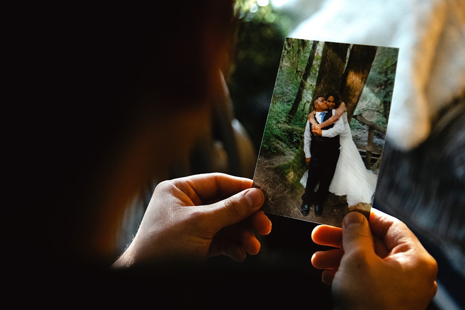 caption: Alex Villatoro, 17, holds a photograph of his parents Leticia and Armando on their wedding day, on Wednesday, March 5, 2025, at his home in Maple Falls, Washington.