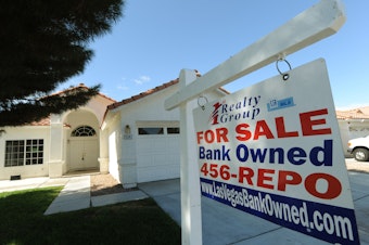 caption: A house under foreclosure in Las Vegas displays a sign on Oct. 15, 2010, saying that it's now bank-owned. Sen. Sherrod Brown has vowed increased scrutiny of Wall Street banks, in part after a surge in foreclosures in his hometown in Ohio over a decade ago.