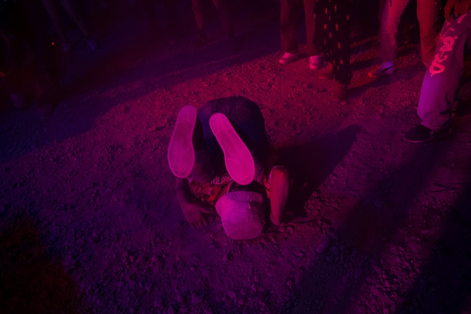 caption: Ravers dance during a renegade rave under a bridge on Saturday, October 19, 2024, in Seattle.