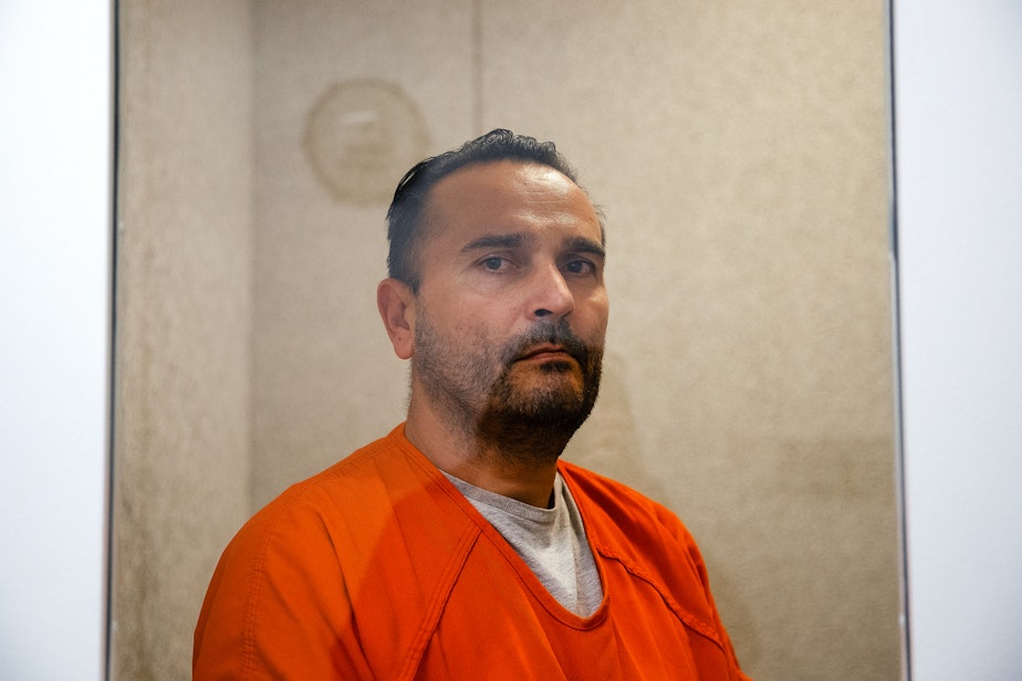 caption: Sergey Kostenyuk is portrayed on Wednesday, April 16, 2025, at the Northwest ICE Processing Center in Tacoma.