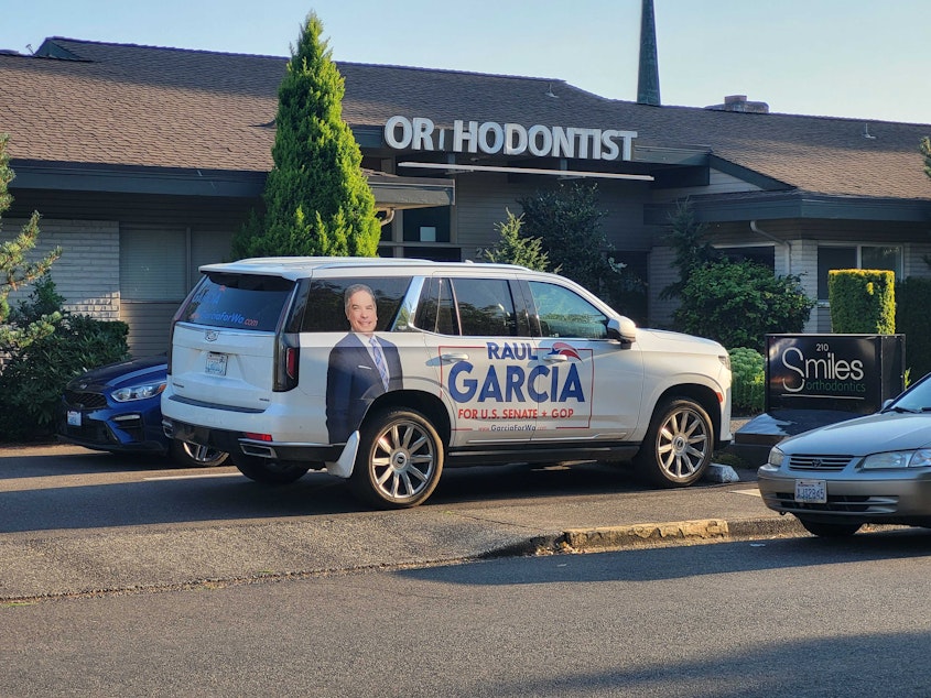 caption: Senate candidate Raul Garcia pulls up to a gathering of Republicans in Pullayup, Wash., this evening -- in an SUV with a photo of his face on the side. Garcia is challenging incumbent Democrat Maria Cantwell for her U.S. Senate seat.