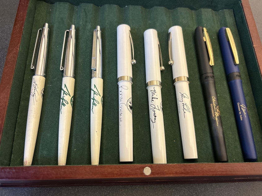 caption: The governors' pen collection of Secretary of State employee Patrick McDonald. From left to right, they are: Gov. Dixy Lee Ray's pen, two pens from Gov. John Spellman's terms, Gov. Booth Gardner's, Gov. Mike Lowry's, Gov. Gary Locke's, Gov. Christine Gregoire's and Gov. Jay Inslee's. Gov. Daniel Evans' are missing from this picture, McDonald said.