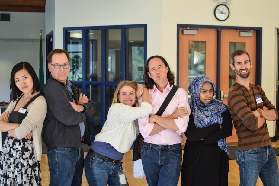 caption: Ross Reynolds and KUOW staff members pose after wrapping up an "Ask a..." event.