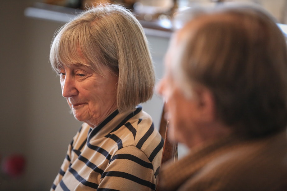 caption: Pam and Ned Johnson talking with KUOW's Patricia Murphy. Ned was declared dead by the Social Security Administration, but he is alive and lives in Seattle.