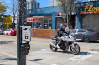 caption: Crosswalk speakers at the corner of 43rd street and University Ave were hacked to play an audio deepfake of Amazon founder Jeff Bezos.