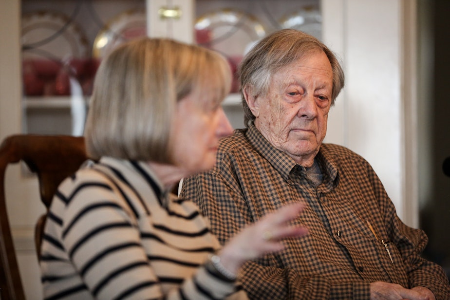 caption: Leonard and Pam Johnson talking to KUOW's Patricia Murphy. Leonard "Ned" Johnson is dealing with the Social Security Administration declaring him dead and stopping his benefits.