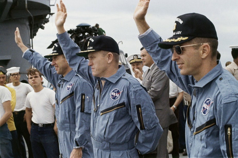 caption: Col. Frank Borman, Apollo 8 astronaut with William Anders, center, and James A. Lovell, Jr., right, on the flight deck of the carrier U.S.S. Yorktown, recovery ship Dec. 27, 1968.