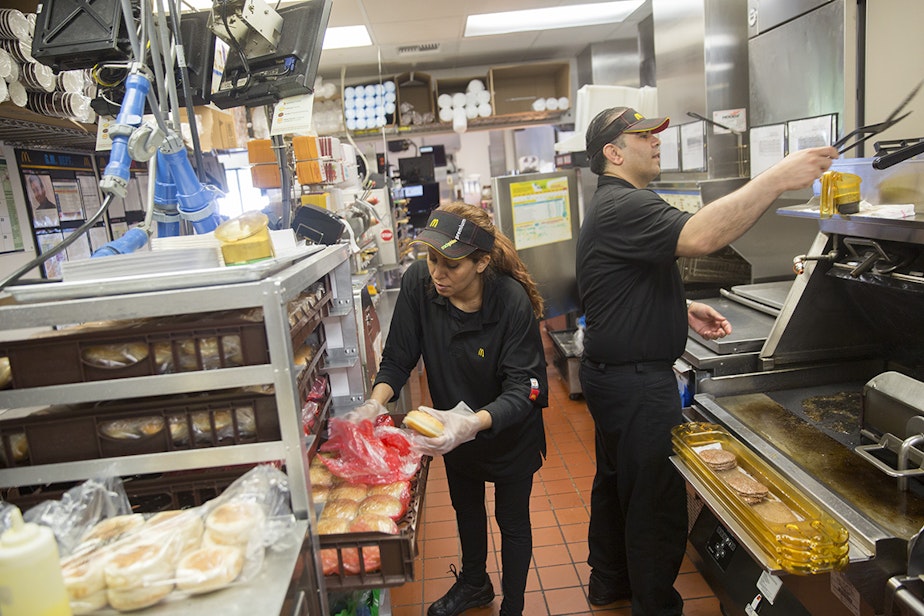 caption: Neda Sharifi Khalafabadi and Peiman Karimi work at McDonald's.