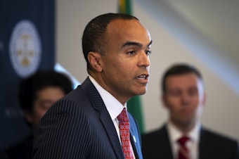 caption: Washington Attorney General Nick Brown addresses members of the press after filing a lawsuit against President Donald Trump’s executive order on birthright citizenship, on Tuesday, January 21, 2025, at the Attorney General’s Office in Seattle. 