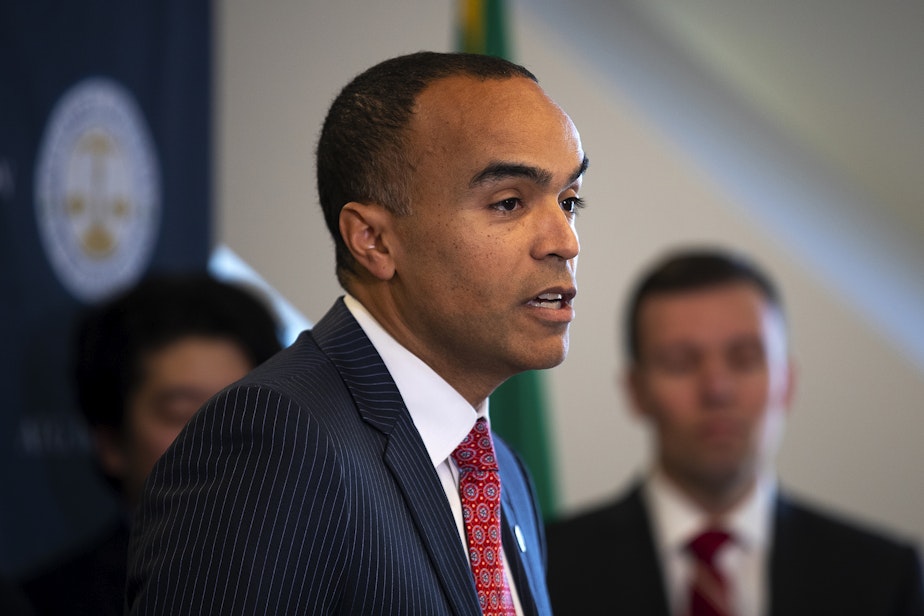 caption: Washington Attorney General Nick Brown addresses members of the press after filing a lawsuit against President Donald Trump’s executive order on birthright citizenship, on Tuesday, January 21, 2025, at the Attorney General’s Office in Seattle.