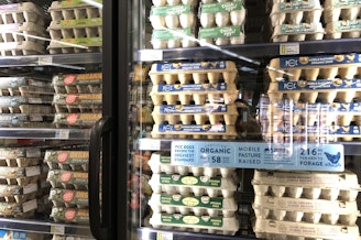 caption: Eggs fill the refrigerator at PCC Columbia City, February 26, 2025. 