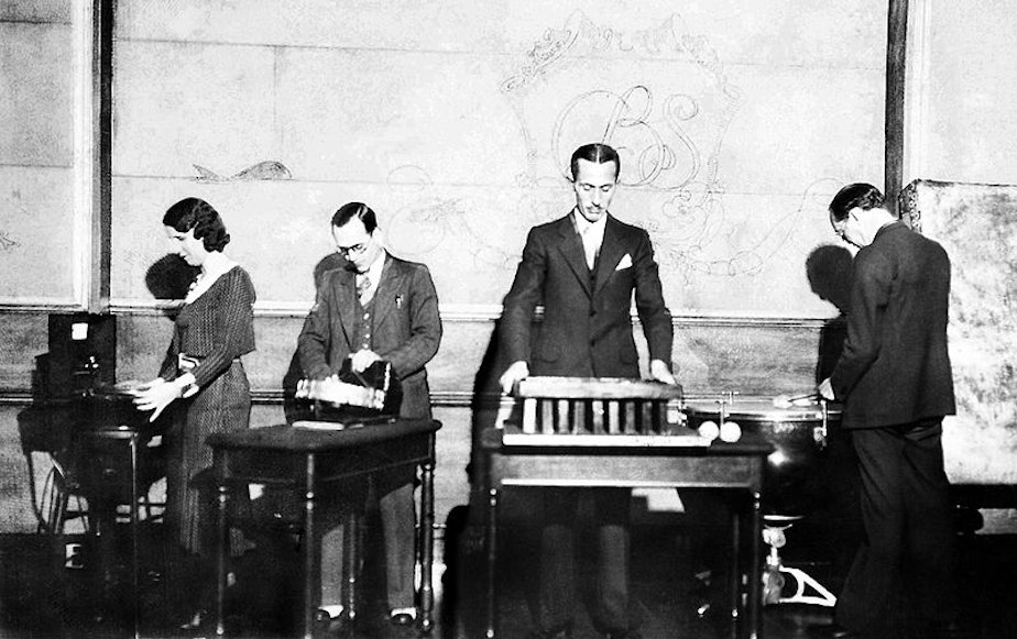 caption: Ora Nichols, left, works on the sound effects for "The March of Time" news reenactment.