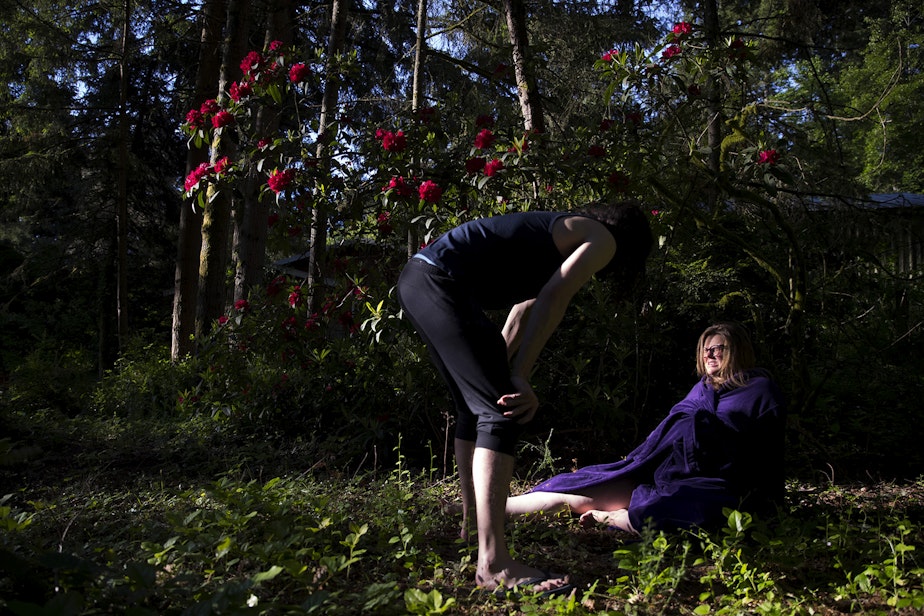 caption: Hope Black breathes through a contraction with her husband Jake, left, while in labor at 7:18 a.m. on Friday, May 28, 2020, in the backyard of their home on Vashon Island.