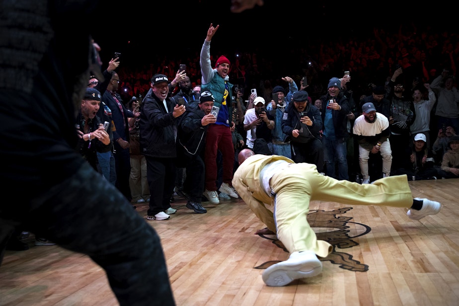 caption: The crowd reacts as Common breakdances while performing at the Red Bull Lords of the Floor event on Saturday, April 6, 2024, at WAMU Theater in Seattle.