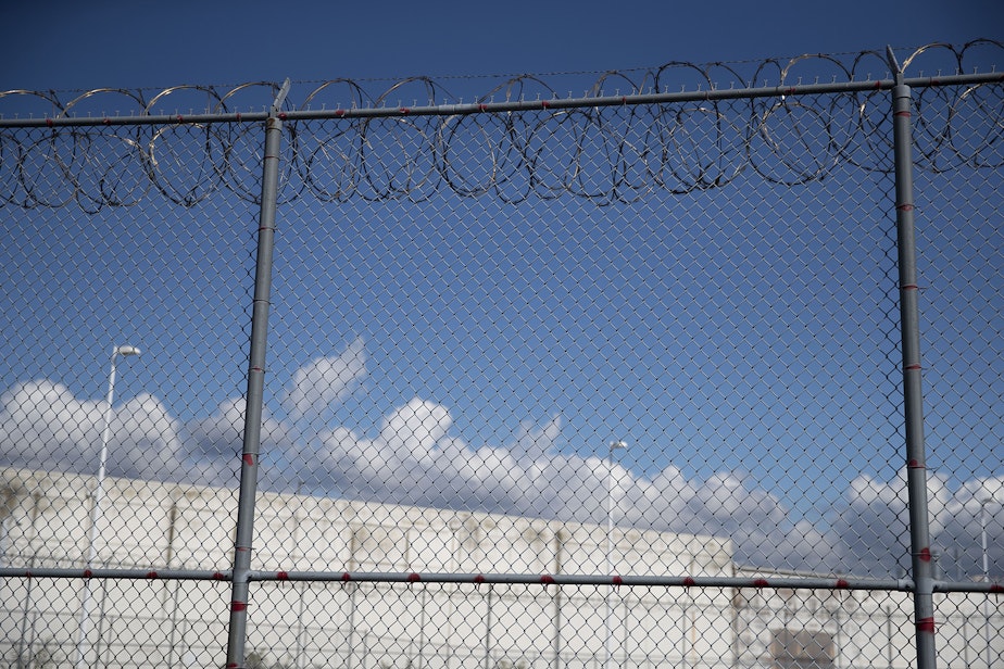caption: A fence outside of the Northwest Detention Center, renamed the Northwest ICE Processing Center, is shown on Tuesday, Sept. 10, 2019, in Tacoma.
