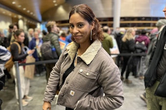 caption: Shaunie Wheeler of MLK Labor waits in line to speak at City Hall on Wednesday evening, Feb. 5, 2025.
