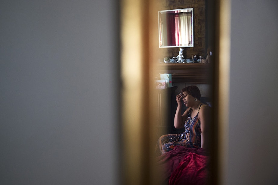 caption: LaDonna Horne is reflected in a mirror as she sits on her son DaShawn Horne's bed after they arrived home from the hospital on Thursday, May 3rd, 2018, at their home in Auburn. “I think I finally just took a deep breath,” LaDonna said.