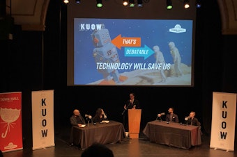 caption: Hanson Hosein, Amy Webb, Vinay Narayan and Elizabeth Scallon participate in KUOW's That's Debatable event on March 24, 2019.